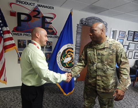 CPT Jordan (right) meets Mr. Renato Garcia (left), project control analyst, P2E.