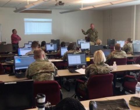 Mr. Longoria (left) and SFC Phelps (right) train soldiers on RPAM. Photo by Mr. Robert Medley.