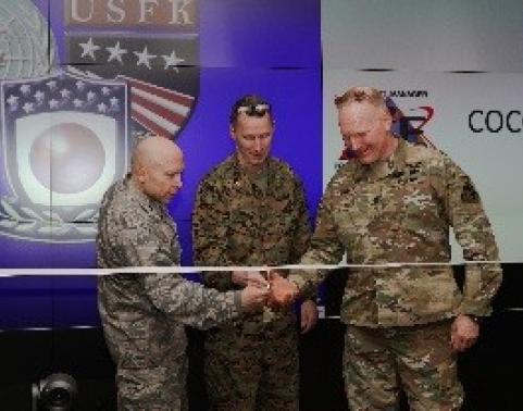 (left to right) Col. Douglas Mellars, United States Forces Korea J6 Strategic Command Center proponent, Col. Robert S. White, USFK J33 Strategic Command Center user, and Lt. Col. Gregory Soulé, Strategic Command Center project provider, cut a ceremonial ribbon signifying the completion of this stage in the life cycle replacement project during a ceremony March 29, 2017 at Command Center Seoul on U.S. Army Garrison Yongsan. The ceremony followed the installation of two high definition command display systems