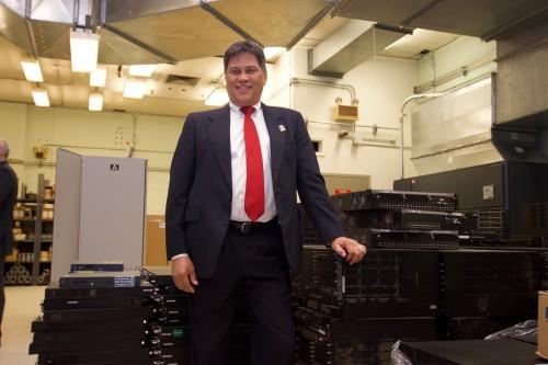 Man leans on piece of equipment.