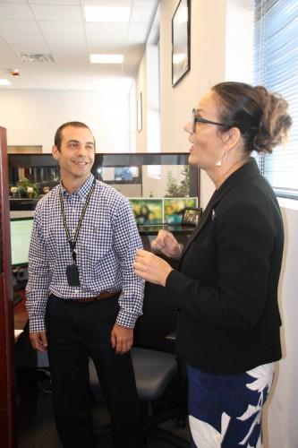 Program Executive Officer Enterprise Information Systems (PEO EIS) Ms. Chérie Smith presents Mr. Chris Pronsati of the Logistics Modernization Program (LMP) with a HOOAH pin.